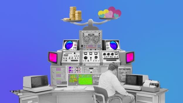 man behind a massive computer with hearts